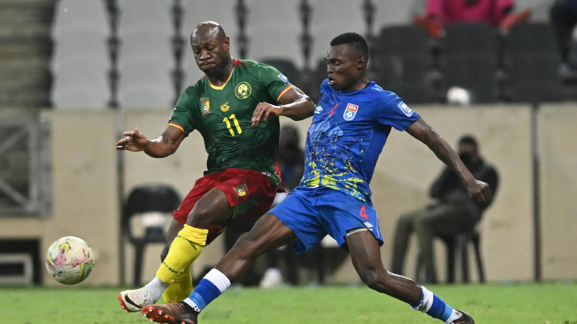 Sihlangu midfielder Neliswa ‘Tiger’ Dlamini closes in on Cameroon’s Christian Bassogg. Sihlangu coach has been fired. (Pic: Courtesy)